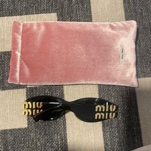Miu Miu Sunglasses black with gold hardware